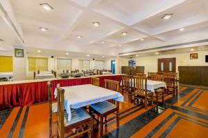 a room with tables and chairs in a classroom at Palette - Hotel Bon Sejour in Puducherry