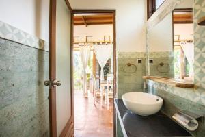 a bathroom with a sink and a mirror at Hidden paradise in Angsri