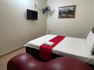 Postel nebo postele na pokoji v ubytování HOÀNG KIM HOTEL
