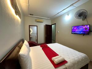 Postel nebo postele na pokoji v ubytování HOÀNG KIM HOTEL