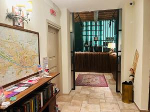 a hallway with a room with a map on the wall at Hotel Nizza in Florence