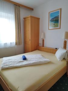 Postel nebo postele na pokoji v ubytování Hotel Pension Kandolf