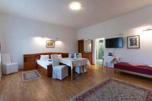 Postel nebo postele na pokoji v ubytování Hotel Pension Kandolf
