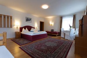 Postel nebo postele na pokoji v ubytování Hotel Pension Kandolf