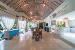 an open kitchen and living room with a pool table at Villa CHANDI 2 - Legian - Seminyak - 5 Bedroom 4 Bathroom Villa - Great Location ! in Seminyak