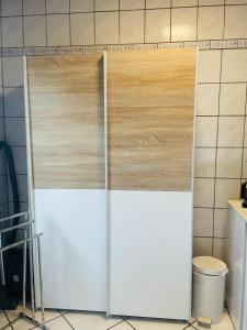 a pair of wooden doors in a kitchen at Restaurant Seeblick direkt am Schweriner See in Bad Kleinen
