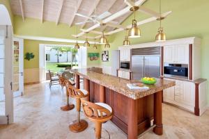 a kitchen with a large island with a counter top at Marsh Mellow by Blue Sky Luxury in Saint James