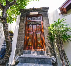 a wooden door on the side of a building at Villa CHANDI 2 - Legian - Seminyak - 5 Bedroom 4 Bathroom Villa - Great Location ! in Seminyak +22 photos