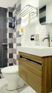 a bathroom with a sink and a toilet at Waterpark Ipoh Manhattan 3BR 8pax Condo Vacation Home by City Home Empire in Ipoh