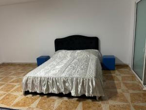 Ein Bett oder Betten in einem Zimmer der Unterkunft Vila Lumi