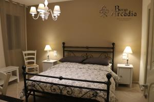 Postel nebo postele na pokoji v ubytování B&B Borgo Arcadia