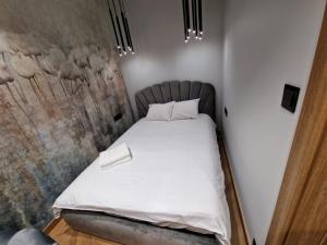 Posteľ alebo postele v izbe v ubytovaní Apartamenty Sebastiana