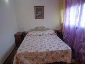 
A bed or beds in a room at Casa Homa
