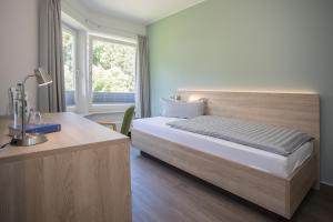 Ein Bett oder Betten in einem Zimmer der Unterkunft St. Bonifatius