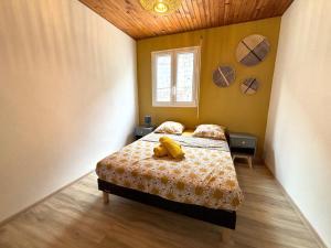 Postel nebo postele na pokoji v ubytování La Kaz'Alice