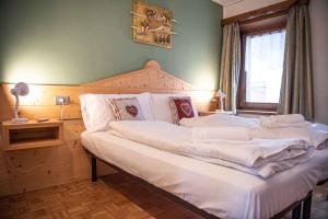 Posteľ alebo postele v izbe v ubytovaní Appartamento Mokino Center Myholidaylivigno + 37 fotografií