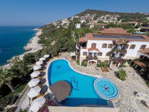 an aerial view of a resort with a swimming pool at Hadrian Hotel in Kaş