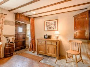 a room with a wooden desk and a chair at 2 Bed in Winster PK885 in Winster