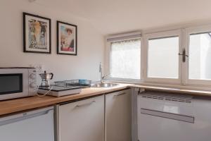 A cozinha ou kitchenette de I Host Apartment - Carcano 26