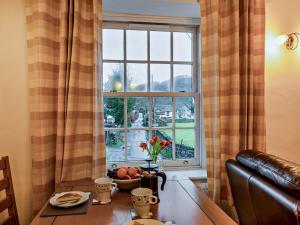 a room with a table and a large window at 1 Bed in Keswick 86246 in Rosthwaite