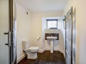 a bathroom with a toilet and a sink at 1 Bed in Keswick 86246 in Rosthwaite