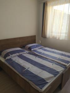 Posteľ alebo postele v izbe v ubytovaní Kolpingház Pécs