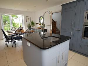 a kitchen with a sink and a dining room at 4 Bed in Hayton SZ119 in Hayton