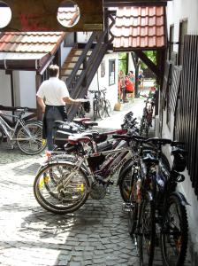 a man is standing next to a bunch of bikes at Penzion "U Kubínů" in Přibyslav