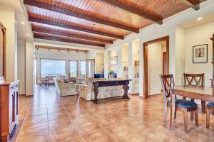 a living room with a ping pong table at Villa Eremia in Pastida