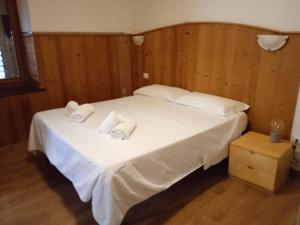 Postel nebo postele na pokoji v ubytování HOTEL BRUSTOLON