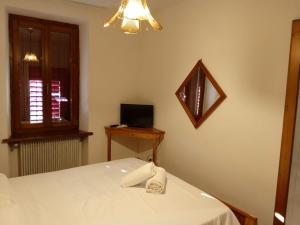 Postel nebo postele na pokoji v ubytování HOTEL BRUSTOLON