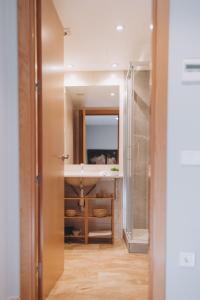 a bathroom with a sink and a mirror at The Orbit Apartments in Barcelona +130 photos