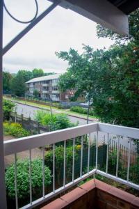 a balcony with a view of a street at 2 Bedroom Apartment with Modern Finishes Hill Tud Stays in Pietermaritzburg