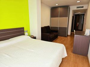 Posteľ alebo postele v izbe v ubytovaní Hotel Clopy Rocamar