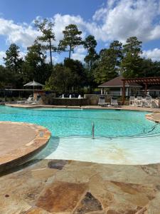 a large swimming pool with blue water at Hidden Gem in Spring Free Parking in Spring