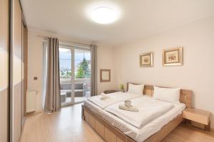 Ένα ή περισσότερα κρεβάτια σε δωμάτιο στο NORTH Apartments Muszelkowa 2