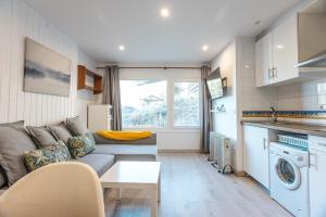a living room with a couch and a table at Apartamento Nature in Sierra Nevada