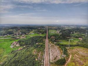 an overhead view of a railroad track in a field at Youbao House in Xiangtan