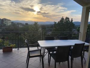 a table and chairs on a balcony with a view at Alloggio turistico Il Tiglio in Canale Monterano