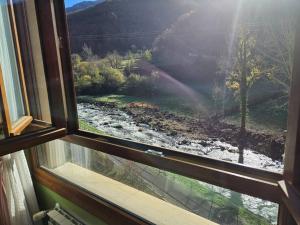 a view of a river from a window at 21A02 Coqueto apartamento con garaje in Felechosa