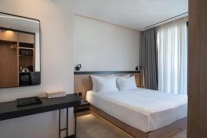 Postel nebo postele na pokoji v ubytování Nema Hotel Athens