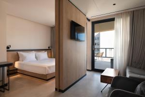 Postel nebo postele na pokoji v ubytování Nema Hotel Athens