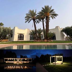 uma casa com palmeiras junto a uma piscina em Villa Daïs - Marrakech em Marrakech