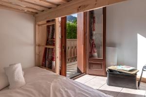 Giường trong phòng chung tại Sapins 11 - Appartement familial - Pied des pistes - Vue sur les montagnes