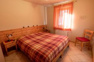 Posteľ alebo postele v izbe v ubytovaní Chalet Alberti