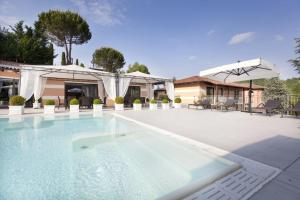 a swimming pool in the middle of a house at Villa Castelletto in Castelletto Molina