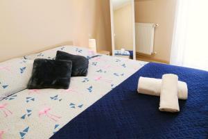 Posteľ alebo postele v izbe v ubytovaní Apartament w Kamienicy na Kłodzkiej