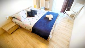 Posteľ alebo postele v izbe v ubytovaní Apartament w Kamienicy na Kłodzkiej
