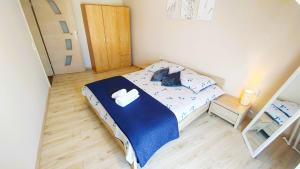 Posteľ alebo postele v izbe v ubytovaní Apartament w Kamienicy na Kłodzkiej