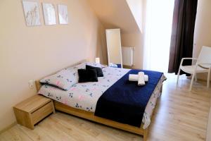 Posteľ alebo postele v izbe v ubytovaní Apartament w Kamienicy na Kłodzkiej